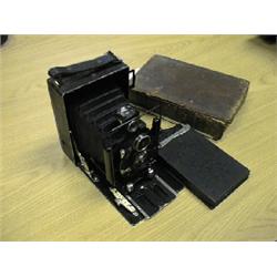 Voightlander folding camera and book.