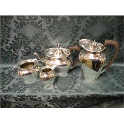 An EPNS 4-piece tea service of rounded rectangular form, the teapot  and hot water jug with compo
