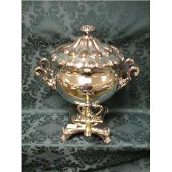 A Sheffield plate samovar with lobed cover, bulbous body having 4  scroll handle supports joined
