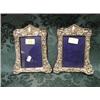 Image 1 : A pair of Edward VII silver photograph frames, embossed with putti,  scrolls and foliage, velvet