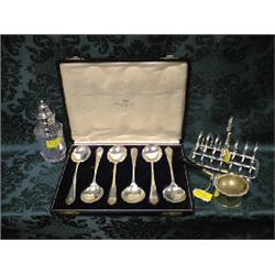 EPNS:  a 7-bar toast rack, a cut glass castor, cased set of soup  spoons, boxed set of dessert sp
