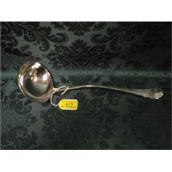 An early George III silver ladle, London 1765, 12".