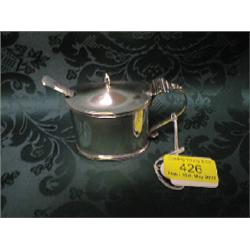 A George IV silver toddy ladle, with an oval bowl, the twist ebonised  handle with plain silver f