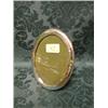 Image 1 : A George V silver photograph frame, oval, with easel stand,  Birmingham 1924, 6 1/2" high.