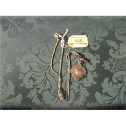 A flexible silver 2-strand longard with ornamental knop, with  attached fob, 10 1/2" long, 26.7gm