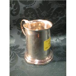 A silver straight sided mug, with scroll handle, Birmingham 1931, 3"  high, 2 1/2ozs.