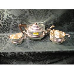 A George V silver 3-piece tea service, oval, with reeded bands above  a slightly swelling body, s