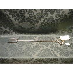 A George III silver toasting fork with knopped shaft and rococo  handle. Maker R Peaston. London