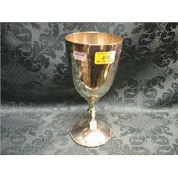 A George V silver trophy cup, the ovoid bowl on a gadroon knopped  stem and swept circular foot w