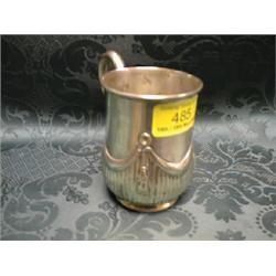 A Victorian silver baluster mug, with scroll handle, the lower body  chased with swags and drapes