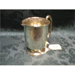A Victorian silver cream jug, with loop handle, the body engraved  with formal scroll-work and pl