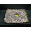 Image 1 : An Edward VII silver dressing table tray, London 1902, oblong,  repousse with scrolls, flowers an