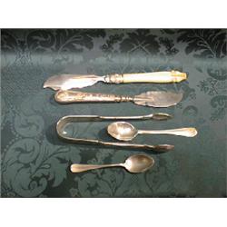 A Victorian silver butter knife, Sheffield 1876 with engraved blade,  scroll ferrule and ivorine