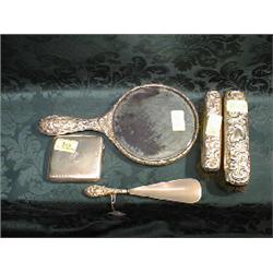 A silver machine turned cigarette box, engraved with initials, a  silver backed hand mirror, 2 br