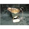 Image 1 : A silver cream jug having a folded shaped rim, scroll handle and on 3  claw feet.  Birmingham 193