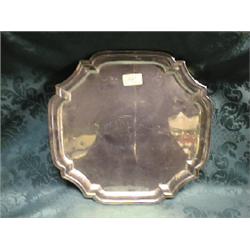 An Indian silver tray, square, with raised and moulded border, on 4  scroll feet, inscribed 'Laho