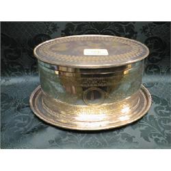 An Edwardian EPNS biscuit barrel and cover, oval, with integral stand, engraved with medallions l