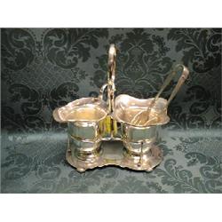An EPNS stand fitted with a sugar bowl and cream jug, of plain design, with hoop handle, on 4 bun