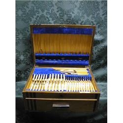 A walnut and ebonised cutlery canteen, with fitted interior and  single drawer, containing a harl