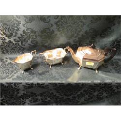 A silver 3-piece tea service, Sheffield 1933, of irregular octagonal  shape, on paw feet, the tea