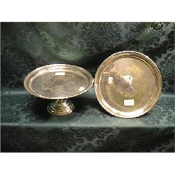 A pair of EPNS tazzae, of plain design, with raised borders, on  knopped stems with raised circul