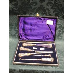 An Edward VII silver dressing set, cased, comprising 2 button hooks,  glove stretchers, shoe horn