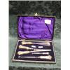 Image 1 : An Edward VII silver dressing set, cased, comprising 2 button hooks,  glove stretchers, shoe horn
