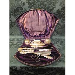 An Edward VII ladies silver manicure set, of 9 pieces, in fitted case, Birmingham 1909/10.