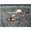 Image 1 : A Victorian child's silver knife, fork and spoon set, the handles  cast with scrolls and foliage,