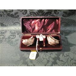 A pair of Victorian silver salts, of boat shape, with reeded bodies  chased with C scrolls, flowe