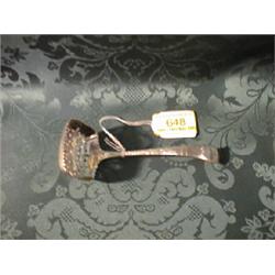 A Victorian silver sugar spoon having a square pierced bowl, with  engraved monogrammed handle, S