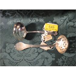 An Edward VII silver sugar spoon, with pierced bowl and triffid  handle, London 1900, another, wi