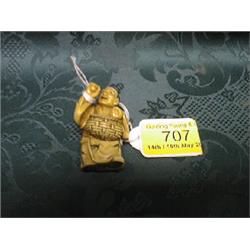 A Japanese ivory netsuke study of a street trader walking offering  peaches from a basket.