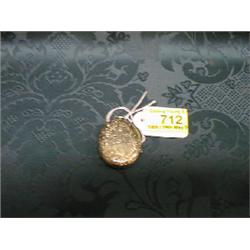 A yellow metal and black enamel memorial locket with star set diamond  to centre and floral engra