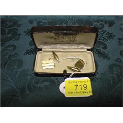 A pair of 9ct gold chain and bar cuff-links with engine turned tops.