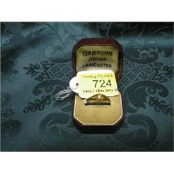 An Edwardian gentleman's signet ring set with a central small stone,  stamped 18ct.