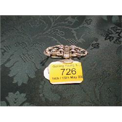 An Art Deco metamorphic brooch and clip set of Odeonesque styling,  having central trap cut diamo