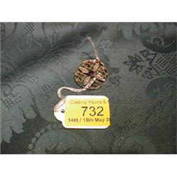 An Edwardian openwork circular yellow metal pendant of floral form  set with seed pearls and amet