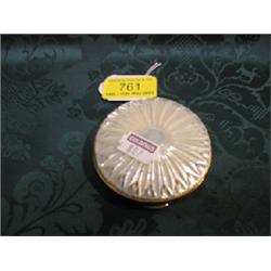 A lady's powder compact, circular, the cover decorated with mother of  pearl.