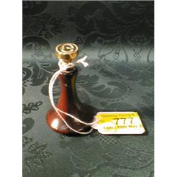 A small wooden and brass seal.