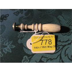 Four various seals and a small brass weight.