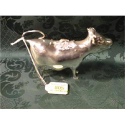 A silver cow creamer. Maker Carr of Sheffield. London assay.  Illustrated on rear cover.