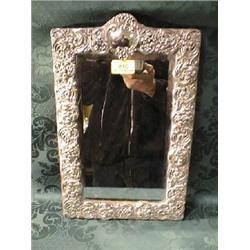 A Victorian silver easel table mirror with bevel plate and rococo  scroll frame. Maker HM, Birmin