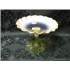 Image 1 : A lime green vaseline glass tazza with fluted foot and flared rim.