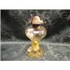 Image 1 : An early 20thC. glass oil lamp, the baluster waisted body moulded with  oval panels, 9" high.