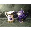 Image 1 : A flo-blue coffee pot with wrythen body, 10" high, and a jug, having  green and gilt moulded borde