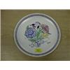 Image 1 : A modern Poole pottery plate centrally decorated with flower spray  within purple and green lines,