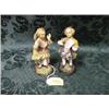Image 1 : A pair of German porcelain figures of a young boy and girl in 18thC. dress, on moulded circular ba