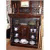 Image 1 : A Victorian carved oak bookcase with central cupboard door