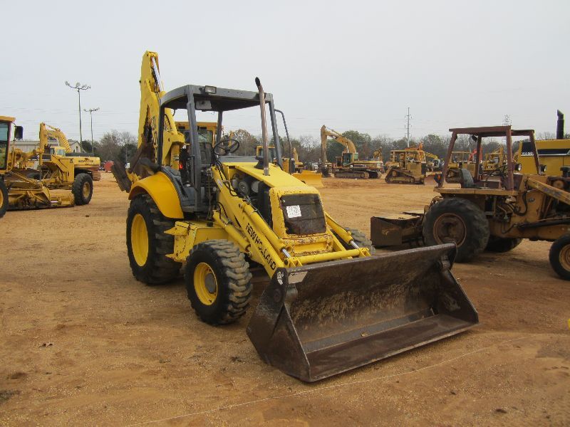 NEW HOLLAND 555E 4X4 LOADER BACKHOE, S/N 31027327, MULTI PURPOSE BUCKET